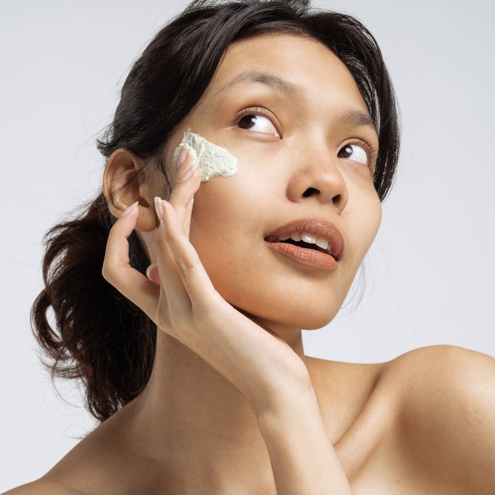 woman apply Cream Cleanser on face
